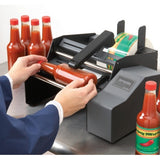 LA-14 benchtop bottle labeller with sauce bottles